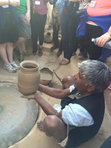 Watching pottery-making  